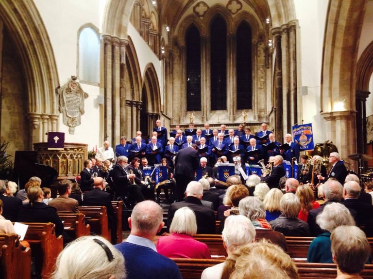 (04) Choir performing to a packed church with Canterbury brass band in a Christmas concert in Hythe.1898556_1062668397087644_7077595818802157667_o